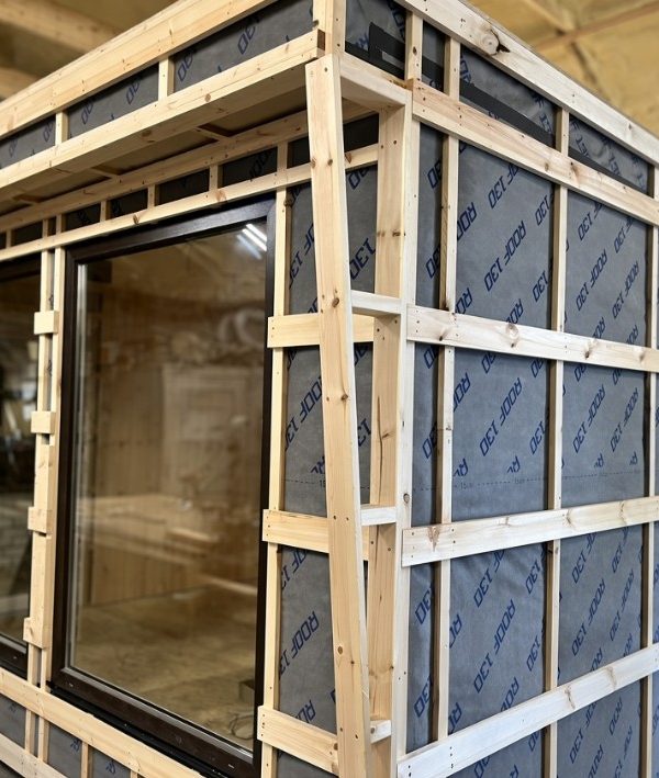 Sauna wall frame with insulation and vapour barrier, before the timber cladding goes on